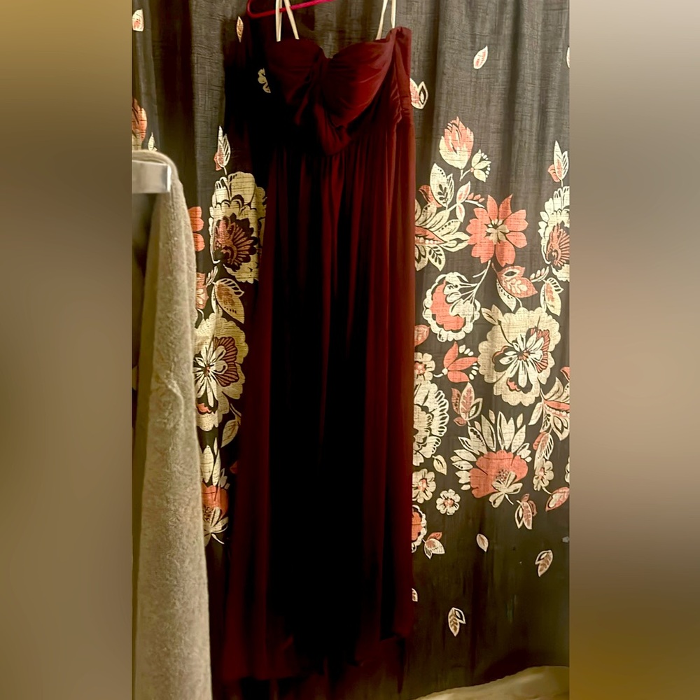 Burgundy strapless gown.